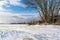 Empty Countryside Landscape in Sunny Winter Day with Snow Covering the Ground, Abstract Background with Deep Look and Dramatic