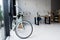 Empty creative office with bicycle and workspace at daytime