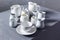 Empty crockery or ceramic dishes set. Kitchen dishware and tableware on grey near wall background