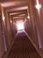 Empty, crooked hotel corridor