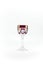 Empty crystal red patterned wine glass. Photographed in the studio on white background. Close up.
