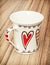 Empty cup with red retro hearts, valentine symbol