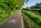 Empty cycling path along the Naviglio Pavese, canal which stretches for 30km from Pavia to Milan, Italy.