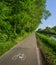 Empty cycling path along the Naviglio Pavese, canal which stretches for 30km from Pavia to Milan, Italy.