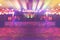 Empty dancing stage in nightclub with colourful lighting background, local concert stage