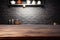 empty dark wooden table against blurred kitchen interior background