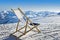 Empty deckchair on the side of a ski slope