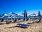 Empty deckchairs and parasols on empty beach