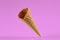 Empty, delicious wafer cone for ice cream against pink background. Concept of food, treats. Mockup, template for your