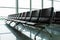 Empty departure lounge with chairs at the airport