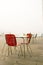 Empty deserted seaside cafe chairs in thick fog
