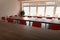 Empty desks and chairs in cafeteria room