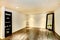 Empty dining room in soft ivory decorated with mirror and flower