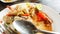 Empty dirty plate seafood paste on wooden table left after lunch