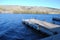 Empty Dock on a Deep Blue Lake