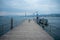 Empty dock with ferry boat at Limmat river with cloudy sky