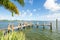 Empty dock on Miami Biscayne Bay with palm tree nice colorful scene