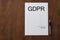 Empty document about GDPR law with blank space on table.