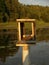 Empty duck house in the center of a lake,