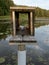 Empty duck house in the center of a lake,