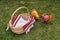 Empty easter basket on green lawn with embroidered handmade towel with text Christ Is Risen.