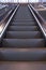 Empty escalator in the airport. Electric staircase in perspective. Mode of transportatioin. Empty elevator in modern building.