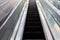 Empty escalator. Minimalism, street photography. Escalator steps. Conceptual photo. Lazy climb.