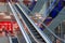 Empty escalator stairs inside a giant modern shopping center. The concept of unprofitability of closing large shopping centers