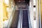 Empty escalator stairs in public building.