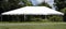 Empty event tent with trees and blue sky