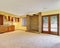 Empty family room interior with soft yellow walls