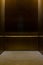 Empty Fancy Elevator Carriage Metal Pole Inside Metal Box Interior Closed Elegant Gold Bronze Overhead Floor Trap Blank Room