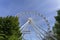 Empty ferris wheel with a blue sky in the background