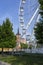 Empty ferris wheel with a blue sky in the background