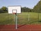 Empty field with basketball stand