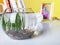 Empty fish tank on the table with books