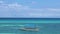 Empty fishing boat anchored near the ocean shore