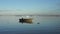 Empty fishing boat floating on a calm sea