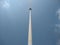 Empty flag pole against the blue sky