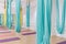 Empty flying yoga studio with colourful hammocks with colourful yoga mats on wooden texture floor at yoga studio in Bangkok