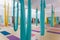 Empty flying yoga studio with colourful hammocks with colourful yoga mats on wooden texture floor at yoga studio in Bangkok