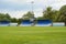 Empty football field with blue stands