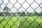 Empty football with wire fence in cloudy summer