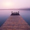 Empty footbridge with a bench on a lake Altausseer at sunrise