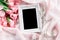 Empty frame with a bouquet sweet pink roses petal on sof
