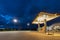 An empty fuel station at night in the summer of Bronnoysund, Norway