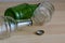 Empty glass beer bottles and beer cork on the table