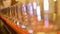 empty glass glasses stand in a line changing focus from first to last beautiful background blur orange table game with