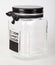 Empty glass jar with black metal lid decorated with words `Home sweet home`