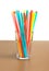 Empty glass with lot of long color cocktail straws